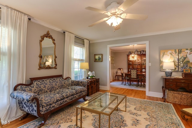 1206 Ivy Ln, Raleigh, NC 27609 - living room featuring wood finished floors, crown molding, a ceiling fan, and baseboards