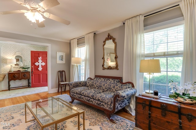 1206 Ivy Ln, Raleigh, NC 27609 - living area with ceiling fan, ornamental molding, wood finished floors, and baseboards