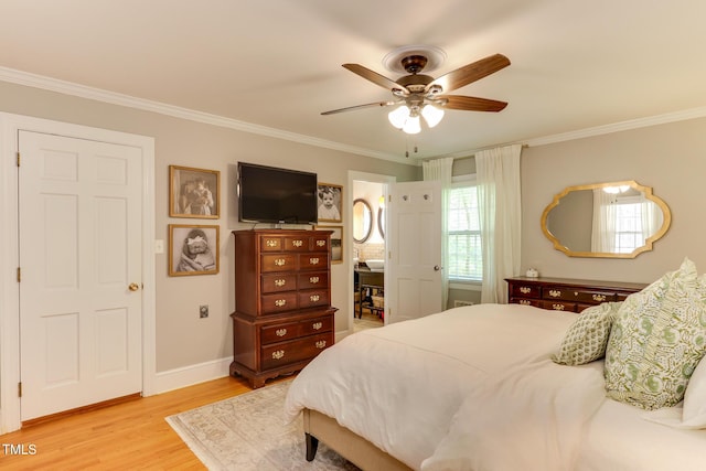 1206 Ivy Ln, Raleigh, NC 27609 - bedroom featuring light wood-type flooring, crown molding, baseboards, and ceiling fan