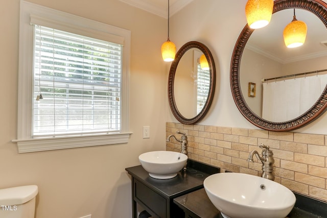 1206 Ivy Ln, Raleigh, NC 27609 - bathroom with tasteful backsplash, ornamental molding, double vanity, and toilet