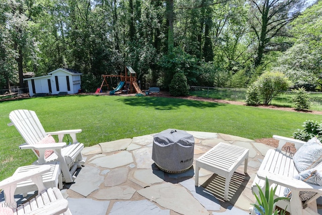 1206 Ivy Ln, Raleigh, NC 27609 - view of patio featuring a playground and an outdoor structure