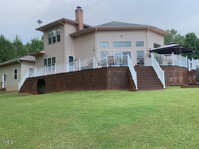 49412 River Run Rd, Albemarle, NC 28001 - back of property with stairway, a chimney, a yard, and a deck