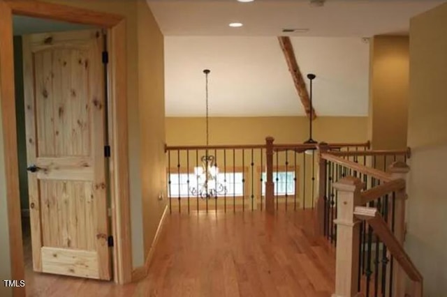 49412 River Run Rd, Albemarle, NC 28001 - hall with wood finished floors, an upstairs landing, a chandelier, baseboards, and recessed lighting