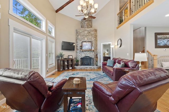 49412 River Run Rd, Albemarle, NC 28001 - living area with high vaulted ceiling, wood finished floors, a fireplace, baseboards, and a chandelier