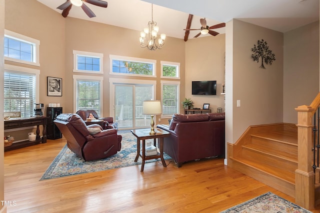 49412 River Run Rd, Albemarle, NC 28001 - living area with ceiling fan, healthy amount of natural light, light wood-type flooring, and a towering ceiling