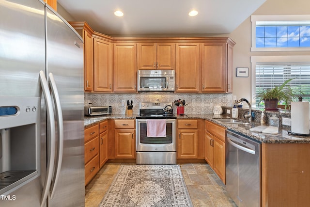 49412 River Run Rd, Albemarle, NC 28001 - kitchen with stainless steel appliances, a sink, stone tile floors, tasteful backsplash, and recessed lighting