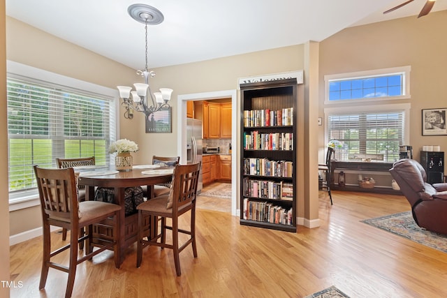 49412 River Run Rd, Albemarle, NC 28001 - dining area featuring a chandelier, light wood-style flooring, baseboards, and ceiling fan