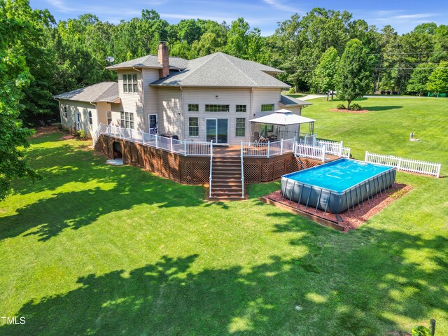 49412 River Run Rd, Albemarle, NC 28001 - rear view of house with stairs, a wooden deck, a gazebo, a chimney, and an outdoor pool