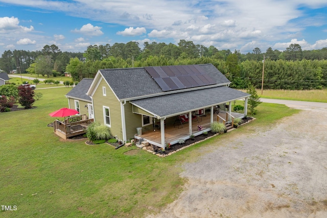 2646 Laurel Mill-Centerville Rd, Louisburg, NC 27549 - view of front facade featuring a shingled roof, driveway, a front yard, a porch, and solar panels