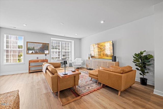 2006 Nola Ln, Durham, NC 27713 - living room featuring light wood-style flooring, baseboards, healthy amount of natural light, and recessed lighting