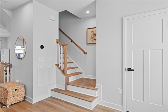 2006 Nola Ln, Durham, NC 27713 - staircase featuring wood finished floors, baseboards, and recessed lighting