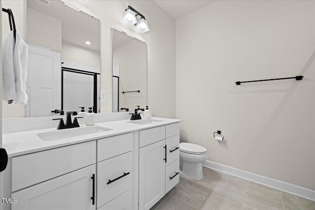 2006 Nola Ln, Durham, NC 27713 - bathroom with baseboards, double vanity, toilet, and a stall shower