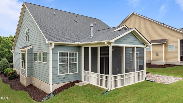 1012 Autumn Meadow Ln, Wake Forest, NC 27587 - back of property with a sunroom, a lawn, and a shingled roof