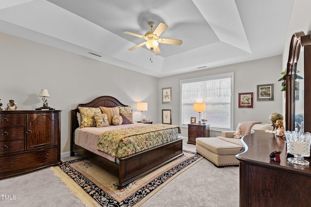 1012 Autumn Meadow Ln, Wake Forest, NC 27587 - bedroom featuring a raised ceiling, light carpet, a ceiling fan, and baseboards