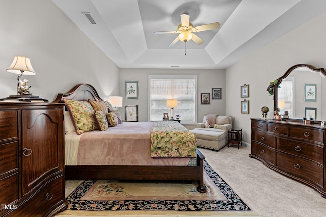 1012 Autumn Meadow Ln, Wake Forest, NC 27587 - bedroom with light colored carpet, a raised ceiling, and ceiling fan