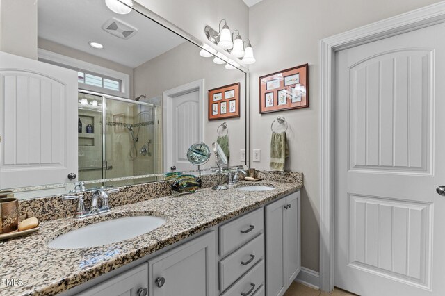 1012 Autumn Meadow Ln, Wake Forest, NC 27587 - full bathroom featuring double vanity and a shower stall