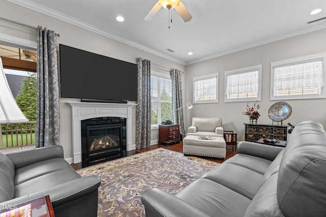 1012 Autumn Meadow Ln, Wake Forest, NC 27587 - living room featuring recessed lighting, a ceiling fan, wood finished floors, a glass covered fireplace, and ornamental molding