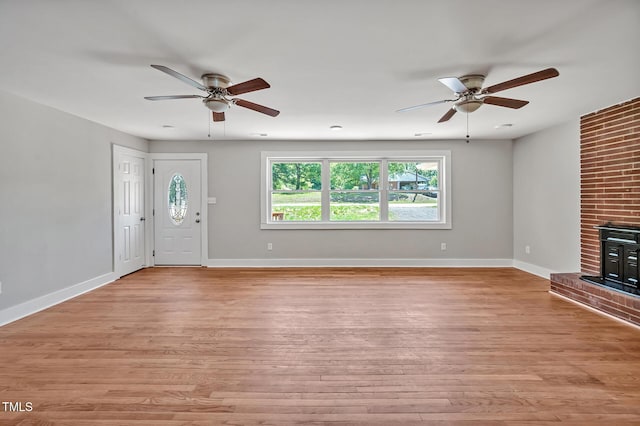 112 S Joyland St, Durham, NC 27703 - unfurnished living room featuring a ceiling fan, plenty of natural light, and light wood-style flooring