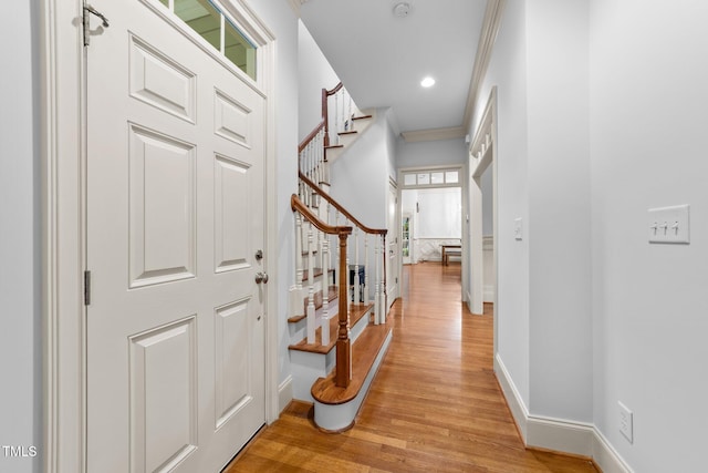 1711 Happiness Hill Ln, Raleigh, NC 27614 - foyer entrance with stairs, light wood-type flooring, baseboards, crown molding, and recessed lighting