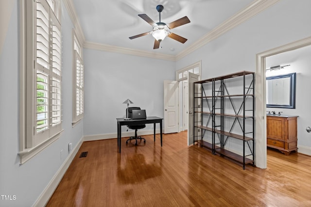 1711 Happiness Hill Ln, Raleigh, NC 27614 - home office with wood finished floors, crown molding, a ceiling fan, and baseboards