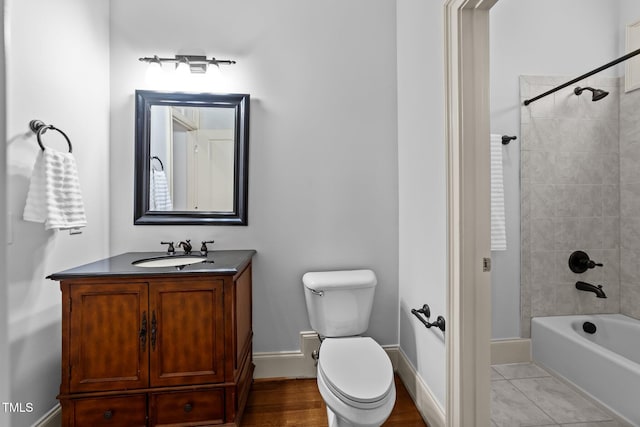 1711 Happiness Hill Ln, Raleigh, NC 27614 - bathroom featuring vanity, toilet,  shower combination, and baseboards