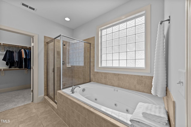 1711 Happiness Hill Ln, Raleigh, NC 27614 - bathroom with a shower stall, a whirlpool tub, a spacious closet, and tile patterned floors
