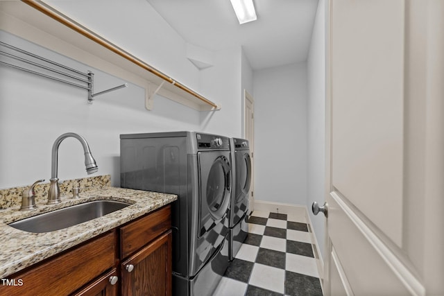 1711 Happiness Hill Ln, Raleigh, NC 27614 - laundry area with dark floors, a sink, and washing machine and clothes dryer
