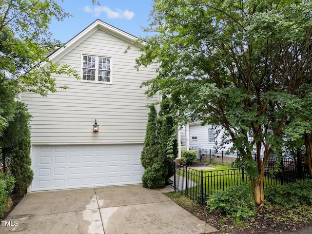 1711 Happiness Hill Ln, Raleigh, NC 27614 - view of side of property with an attached garage and concrete driveway