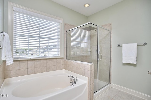 808 Historian St, Raleigh, NC 27603 - full bath with a garden tub, a stall shower, and tile patterned flooring