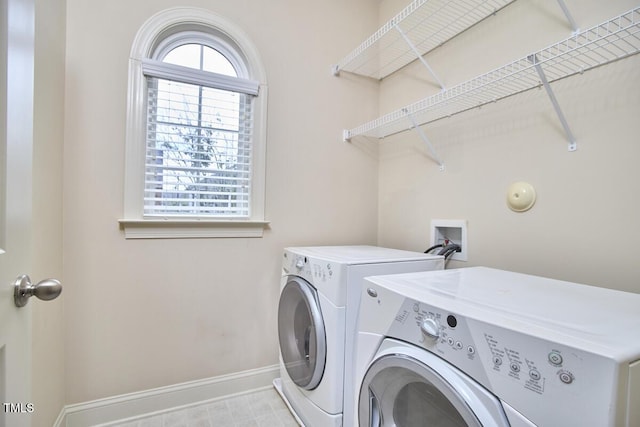 808 Historian St, Raleigh, NC 27603 - laundry room featuring washing machine and clothes dryer and baseboards