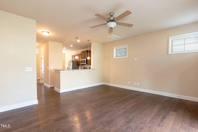 2808 Carter Finley Pl, Raleigh, NC 27606 - unfurnished living room with a ceiling fan and dark wood-style floors