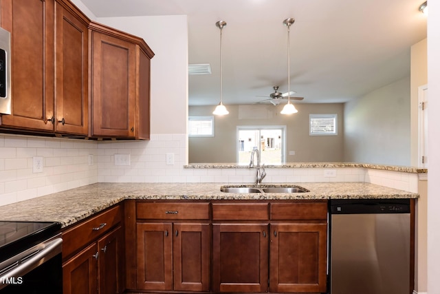 2808 Carter Finley Pl, Raleigh, NC 27606 - kitchen featuring dishwasher, backsplash, a ceiling fan, light stone counters, and brown cabinetry
