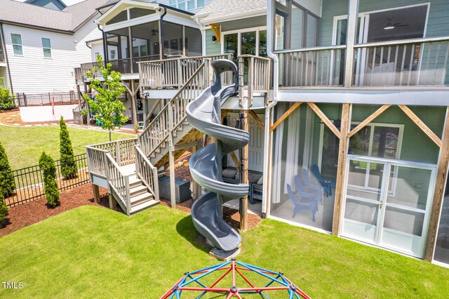 386 Monteith Dr, Chapel Hill, NC 27516 - rear view of house featuring a sunroom, stairway, and a ceiling fan