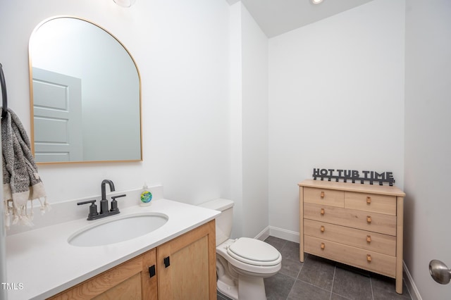 386 Monteith Dr, Chapel Hill, NC 27516 - bathroom with toilet, vanity, tile patterned floors, and baseboards