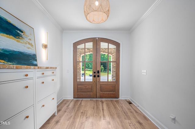 386 Monteith Dr, Chapel Hill, NC 27516 - foyer featuring light wood-type flooring, french doors, arched walkways, ornamental molding, and baseboards