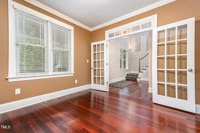 2201 Karns Pl, Raleigh, NC 27614 - spare room with french doors, wood finished floors, ornamental molding, and stairway