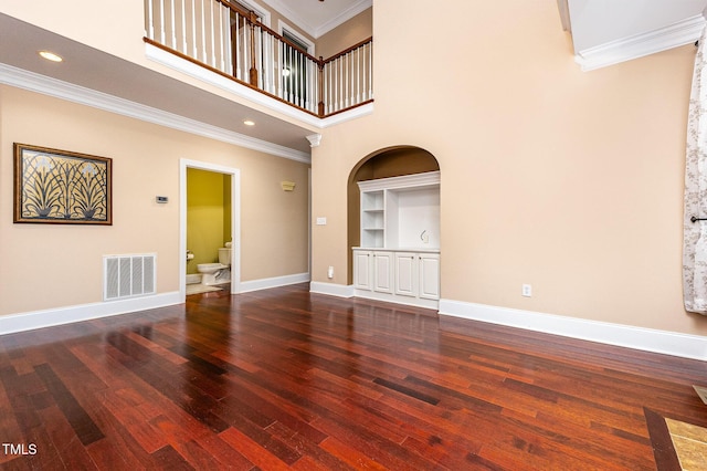 2201 Karns Pl, Raleigh, NC 27614 - unfurnished living room featuring wood finished floors, ornamental molding, a high ceiling, built in features, and recessed lighting