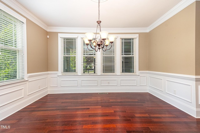 2201 Karns Pl, Raleigh, NC 27614 - unfurnished dining area featuring a chandelier, healthy amount of natural light, crown molding, a wainscoted wall, and dark wood finished floors