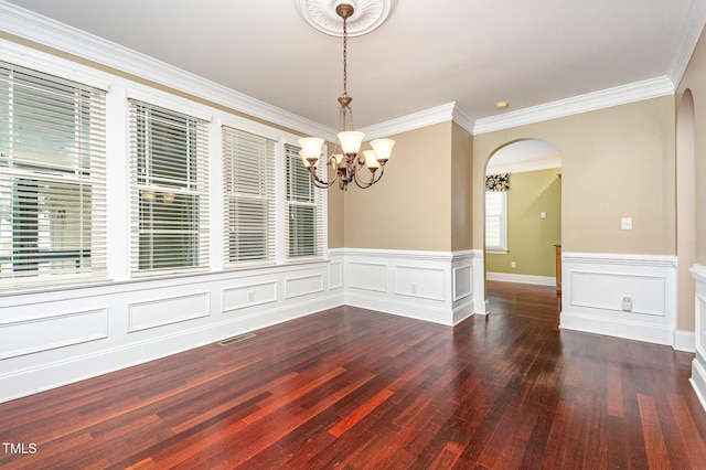 2201 Karns Pl, Raleigh, NC 27614 - unfurnished room featuring arched walkways, dark wood-style flooring, ornamental molding, a chandelier, and a wainscoted wall