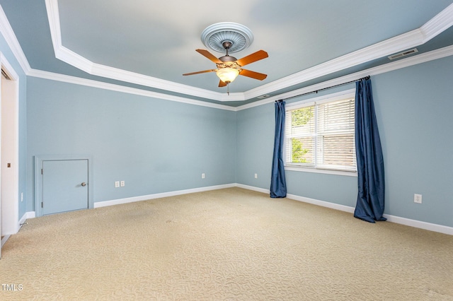 2201 Karns Pl, Raleigh, NC 27614 - empty room with crown molding, a ceiling fan, a tray ceiling, and carpet flooring