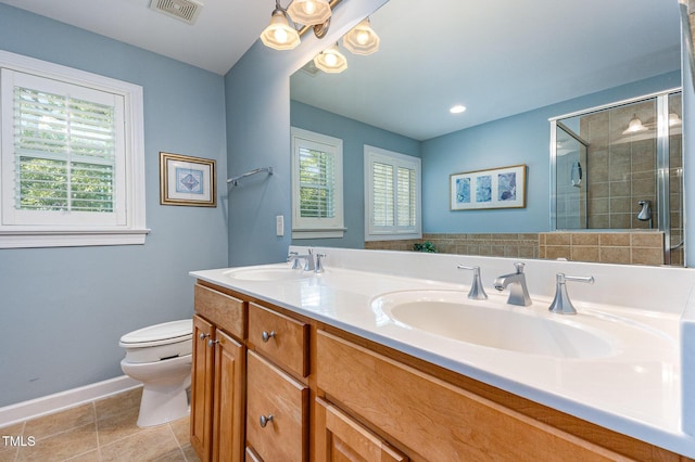 2201 Karns Pl, Raleigh, NC 27614 - full bath with double vanity, healthy amount of natural light, a shower stall, and tile patterned floors