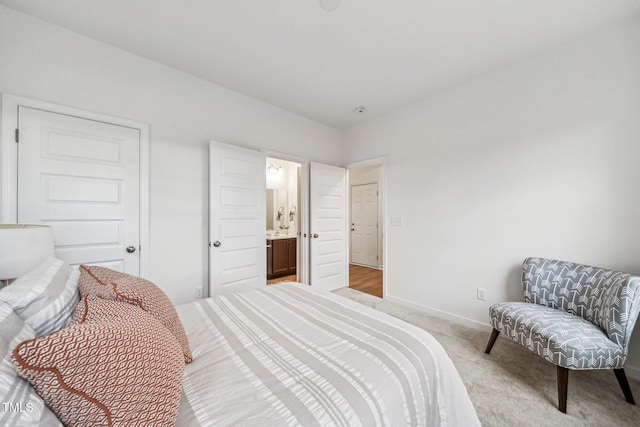 149 Cribbs Ln, Middlesex, NC 27557 - carpeted bedroom featuring baseboards and connected bathroom