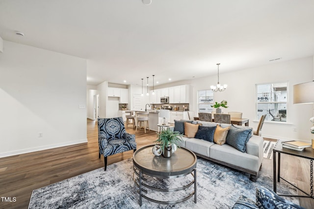 149 Cribbs Ln, Middlesex, NC 27557 - living room featuring light wood-type flooring, a chandelier, recessed lighting, and baseboards