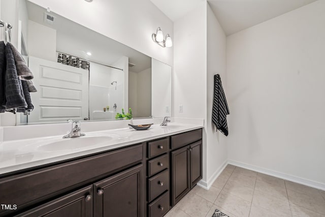 149 Cribbs Ln, Middlesex, NC 27557 - bathroom featuring double vanity, baseboards, tile patterned floors, and shower / tub combination
