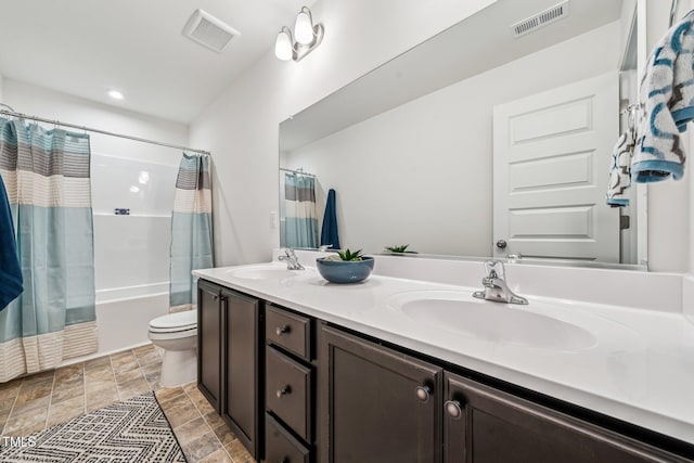 149 Cribbs Ln, Middlesex, NC 27557 - full bath featuring stone finish floors, shower / bathtub combination with curtain, double vanity, and toilet