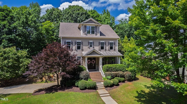 101 Eden Glen Dr, Holly Springs, NC 27540 - colonial-style house with a front lawn and stairs