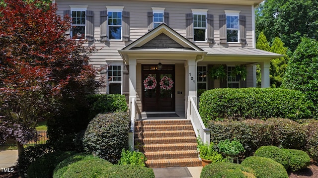 101 Eden Glen Dr, Holly Springs, NC 27540 - doorway to property featuring a standing seam roof and metal roof