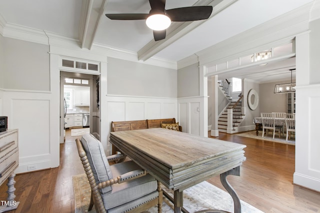 101 Eden Glen Dr, Holly Springs, NC 27540 - dining area featuring stairs, beamed ceiling, wood finished floors, a decorative wall, and a ceiling fan