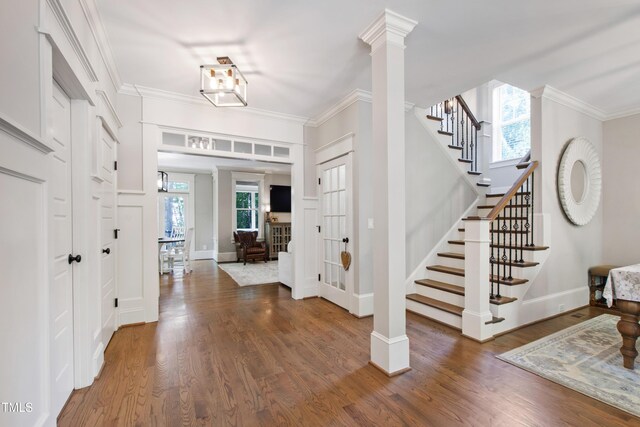 101 Eden Glen Dr, Holly Springs, NC 27540 - foyer featuring stairs, wood finished floors, baseboards, and crown molding
