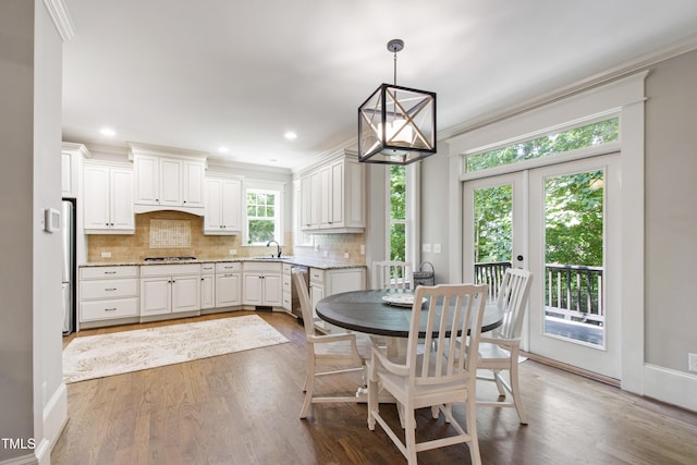 101 Eden Glen Dr, Holly Springs, NC 27540 - dining space featuring wood finished floors, ornamental molding, and recessed lighting
